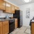 a kitchen with wooden cabinets