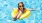a girl in a pool wearing goggles and a life jacket