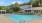 a swimming pool in front of a house